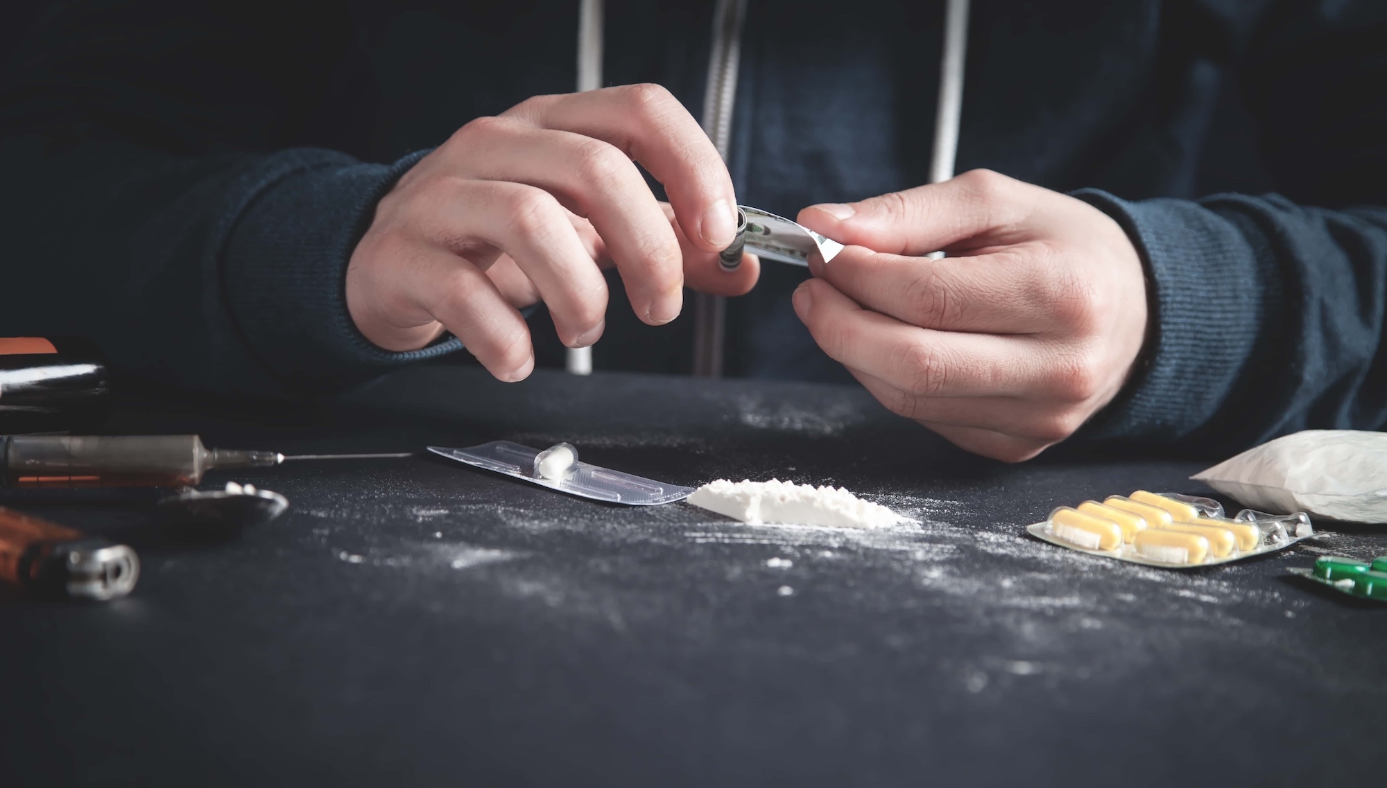 Drug addict taking cocaine. Addiction