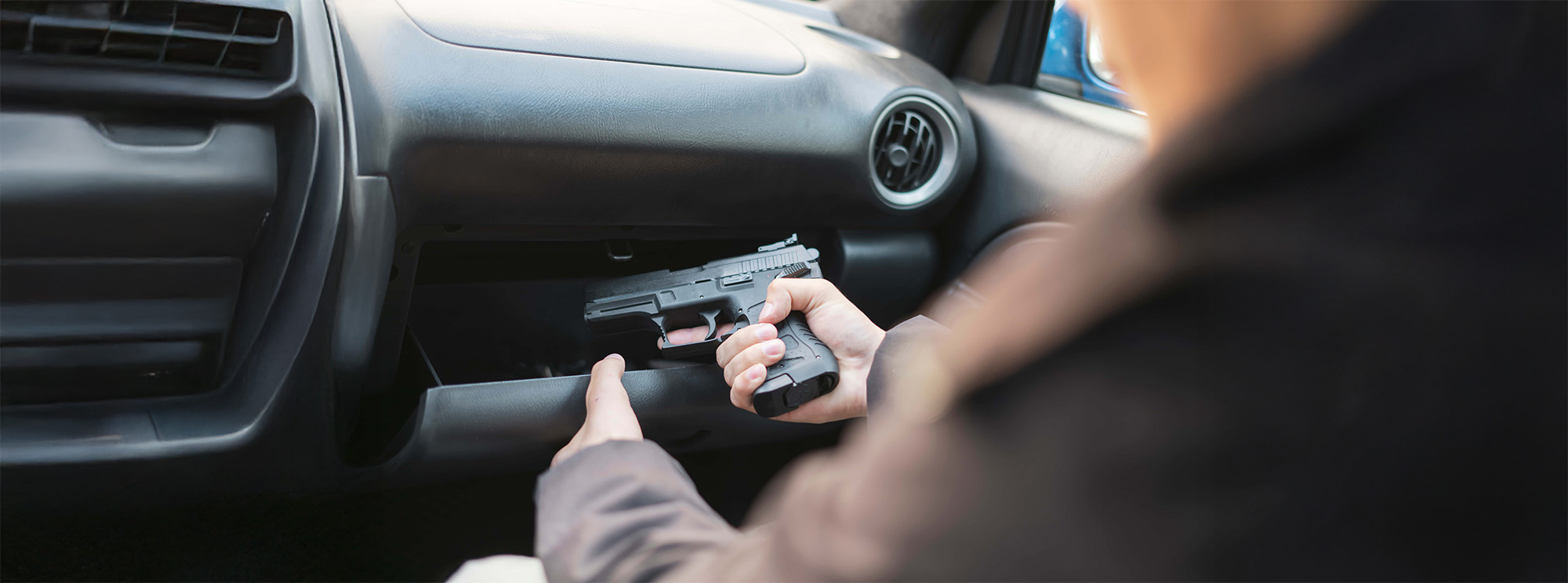 crime concept burglar taking the pistol and plannung a murder