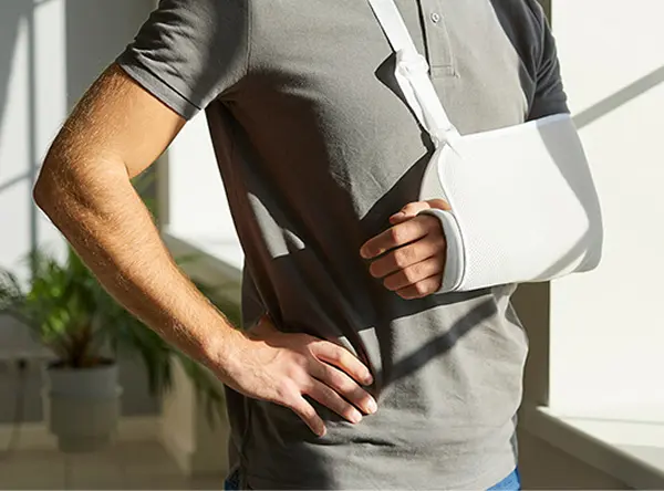 man in arm sling