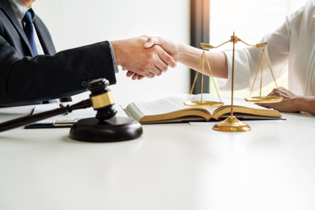 Handshake after cooperation between attorneys lawyer and clients discussing a contract agreement hope of victory over legal fighters, Concepts of law, advice