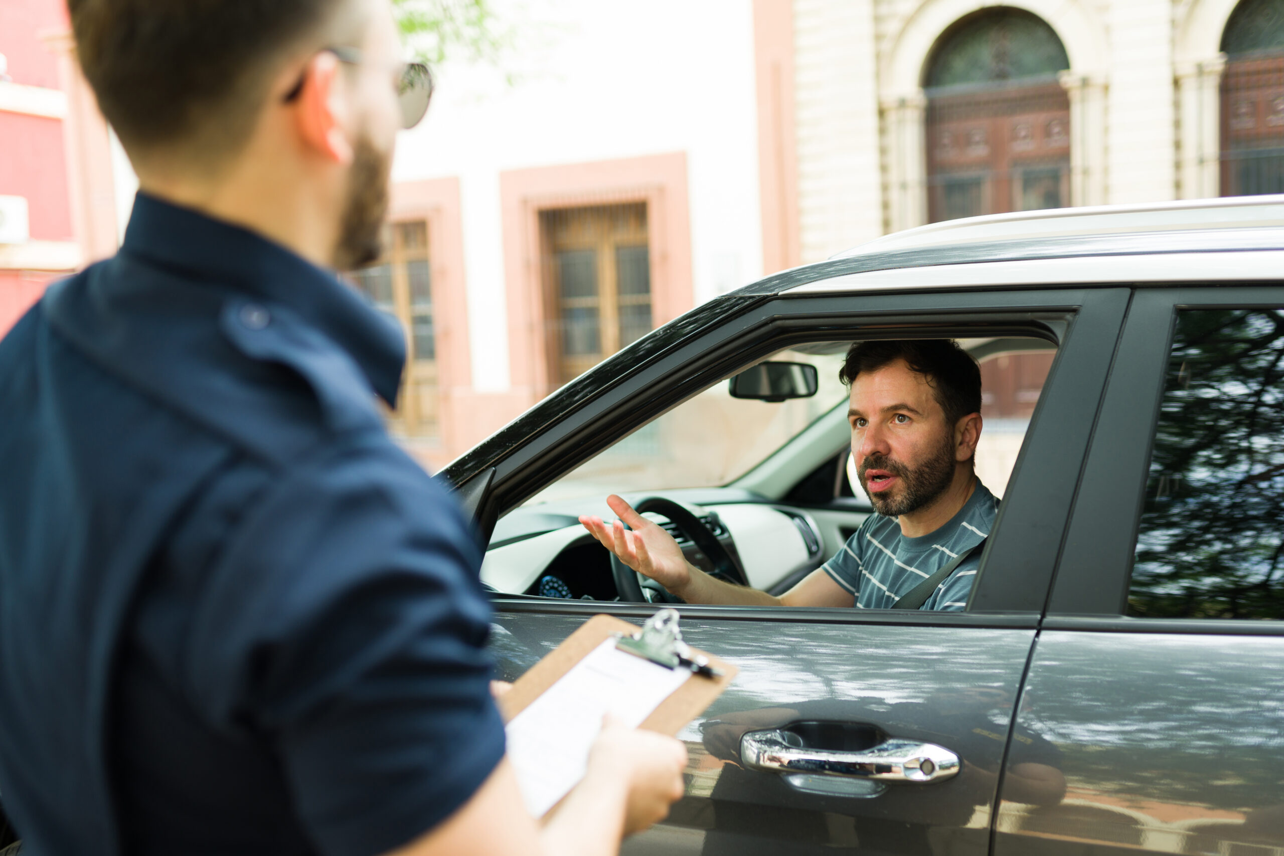 angry driver arguing with cop over speeding ticket